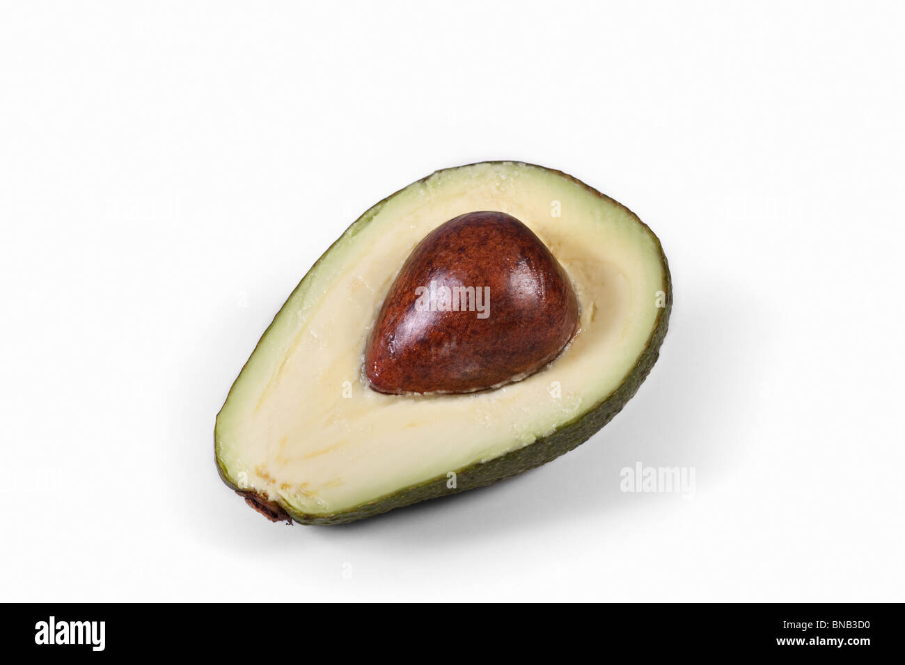 Cross section of a ripe Avocado Pear. Family: Lauraceae, Genus: Persea, Species: P. Americana. Isolated. Stock Photo