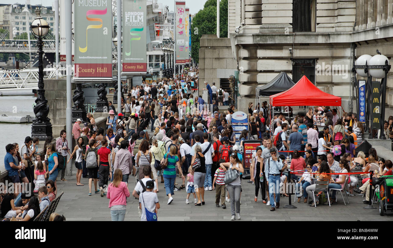 Crowds of Tourists on the Southbank. Stock Photo
