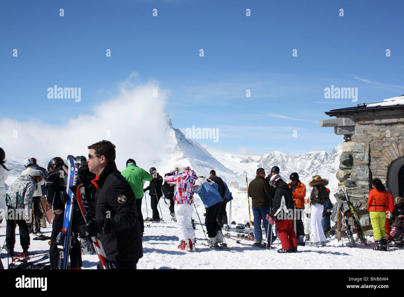 Gornergrat, Crowds of skiers preparing to descend. Stock Photo