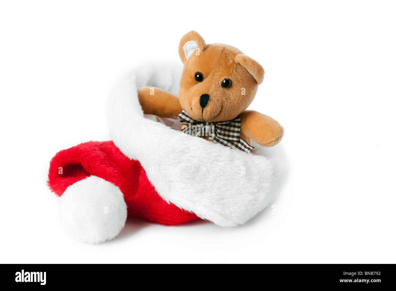 teddy bear and xmas cap on white background Stock Photo - Alamy