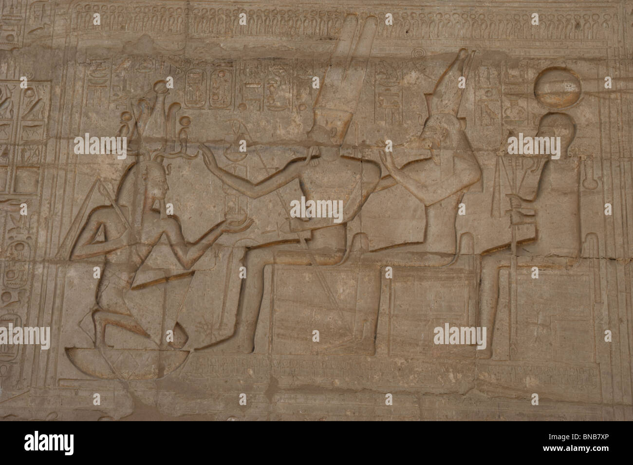 Relief depicting a Pharaoh Ramses II before gods Amun, Munt and Khonsu. Ramesseum. Egypt. Stock Photo