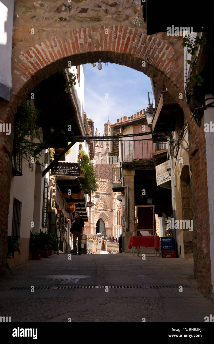 View of Royal Monastery of Santa Maria de Guadalupe from a narrow street. Stock Photo