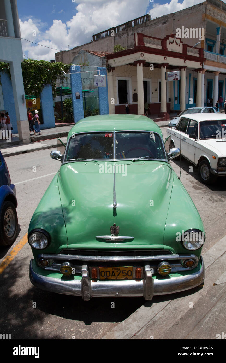 old chevy parked up in holguin square, cuba Stock Photo