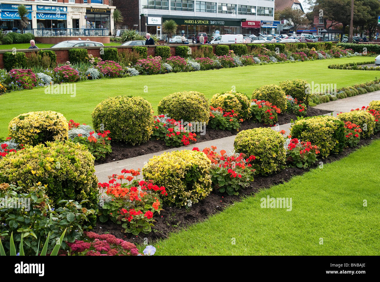 Symmetrical borders flanking a garden in Lytham St Annes Lancashire Stock Photo