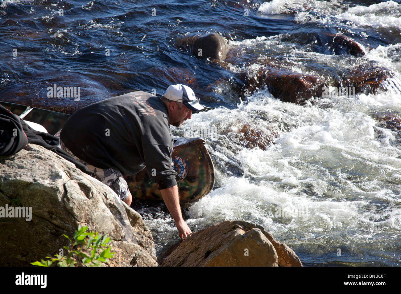 Campton, New Hampshire A man wading on the Pemigewasset River in the
