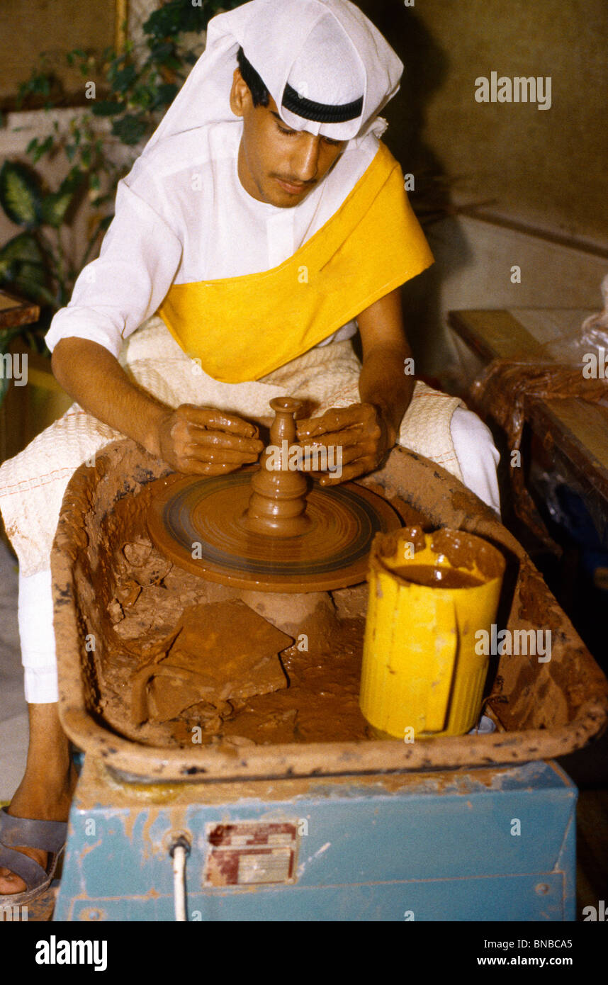Potter throwing candlestick holder UAE Stock Photo Alamy