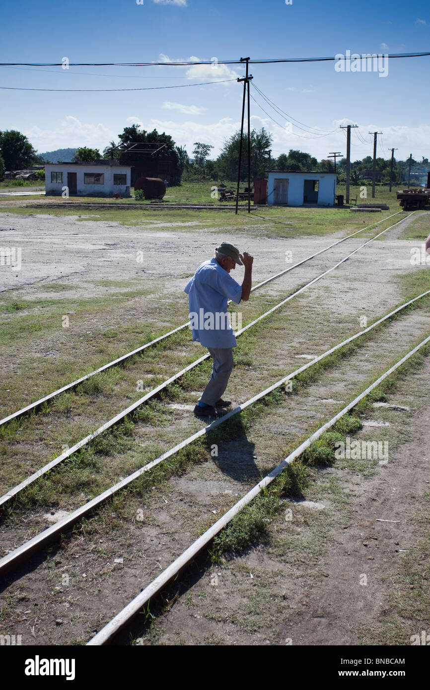 drunk man dancing on railway lines. Stock Photo