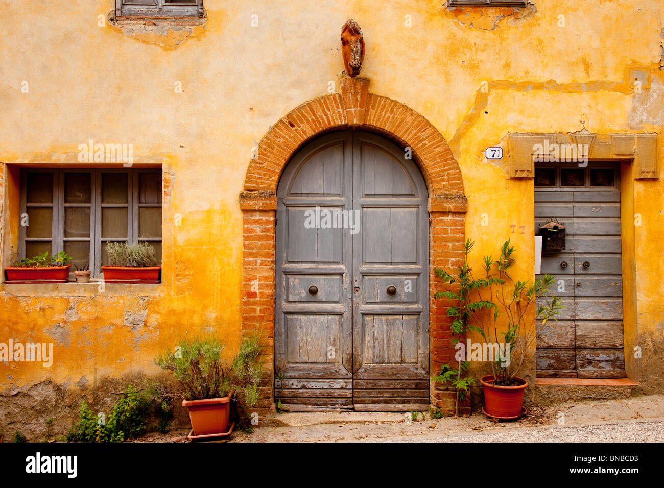 Front door to home in La Foce, Tuscany Italy Stock Photo