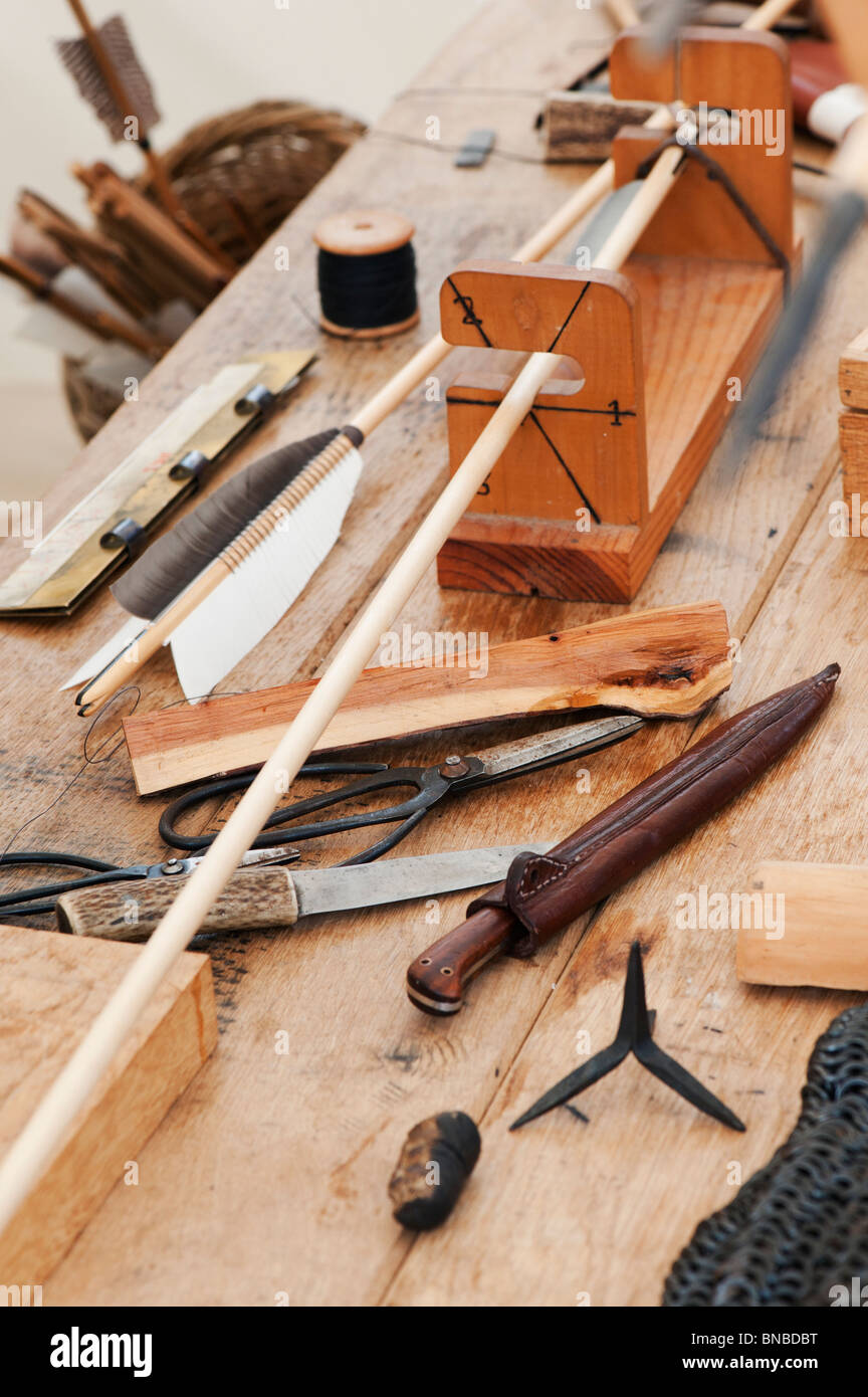 Making Medieval arrows by a fletcher at Tewkesbury medieval festival