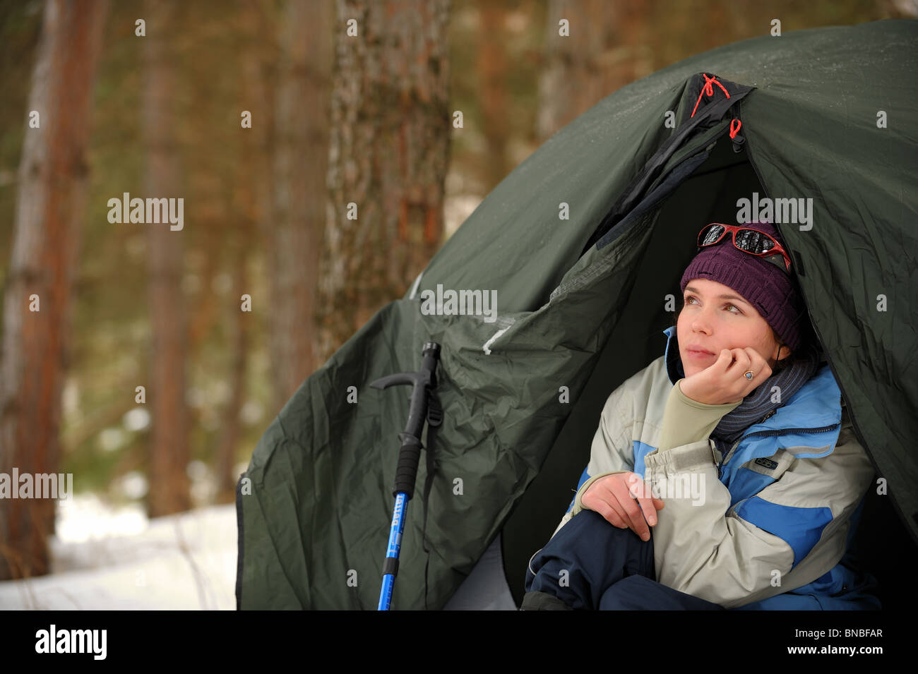 Pretty tourist woman in a tent Stock Photo