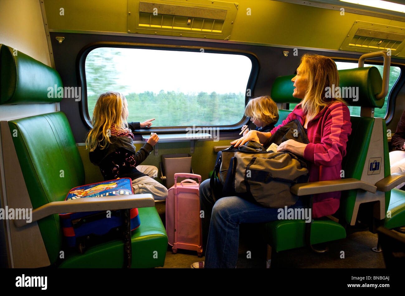 Mother and her children traveling by train, Netherlands, Holland, Europe Stock Photo
