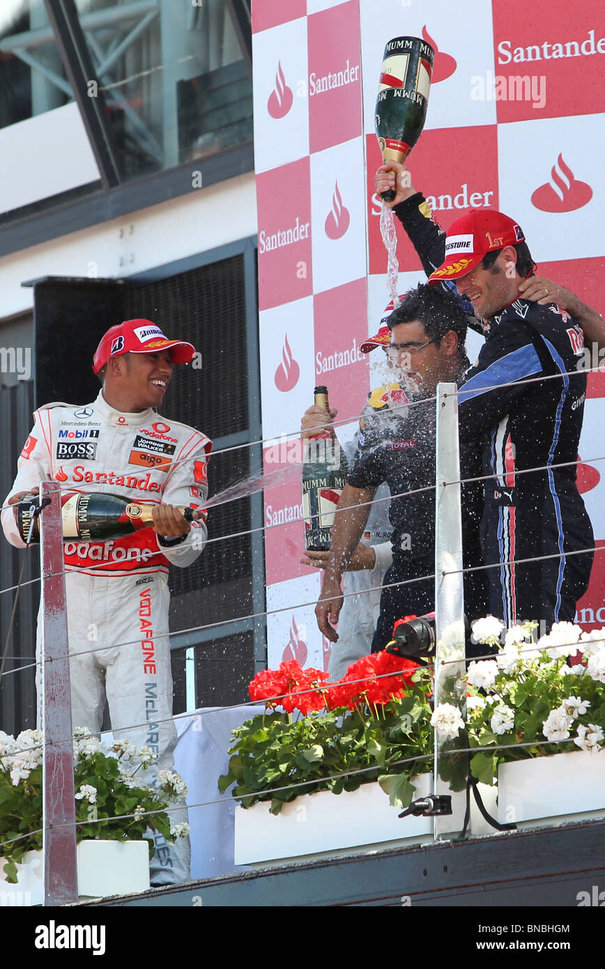 Lewis Hamilton and Mark Webber on the podium at the end of the British Formula 1 Grand Prix 11th July 2010 Stock Photo
