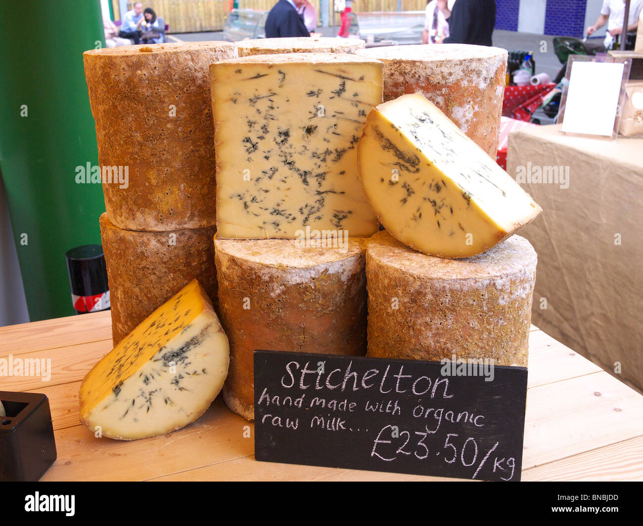 Stichelton cheeses on display for sale on a stall at Borough Market Stock Photo