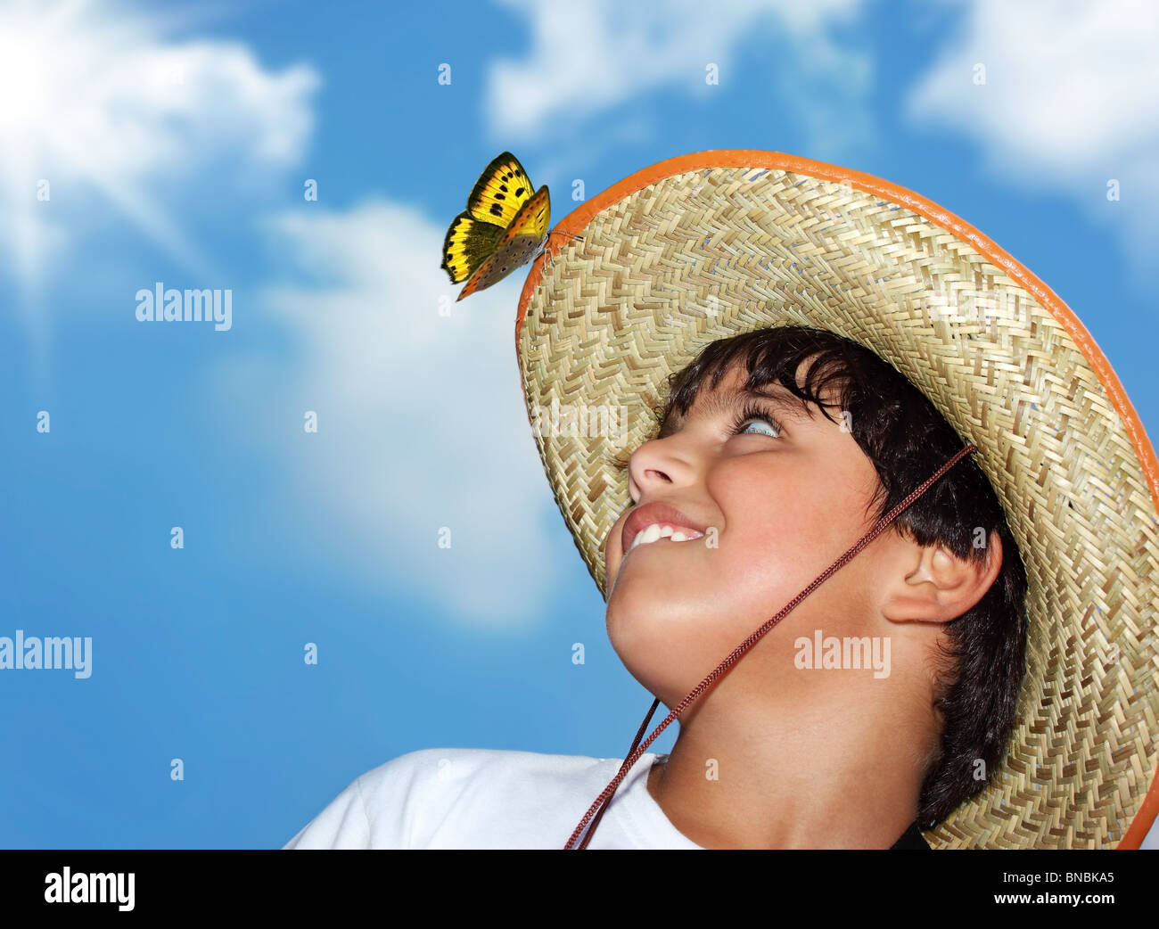 Portrait of a young beautiful boy over blue sky Stock Photo - Alamy