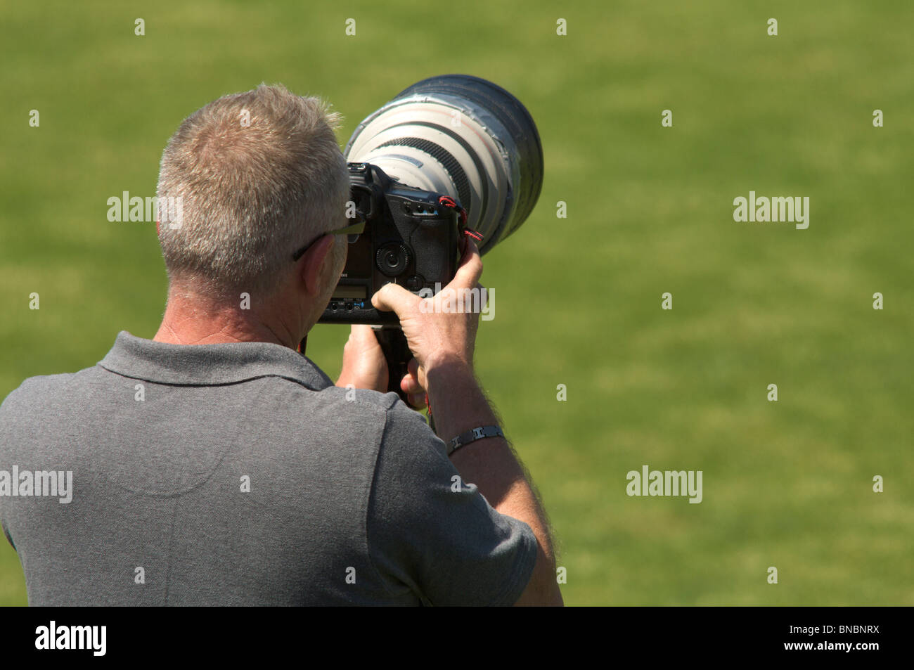 sports photographer using telephoto lens Stock Photo Alamy