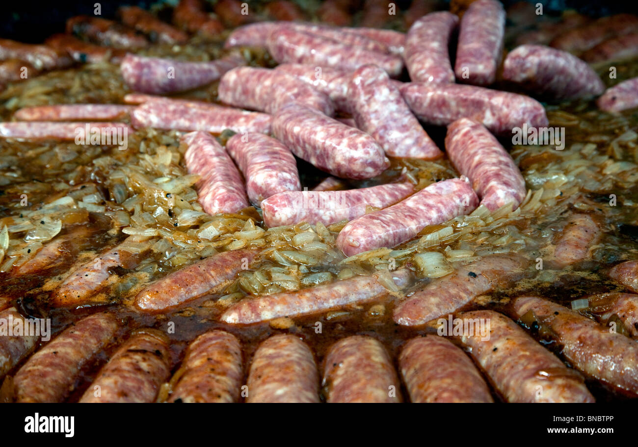 Sausages cooking at French festival in London Stock Photo Alamy