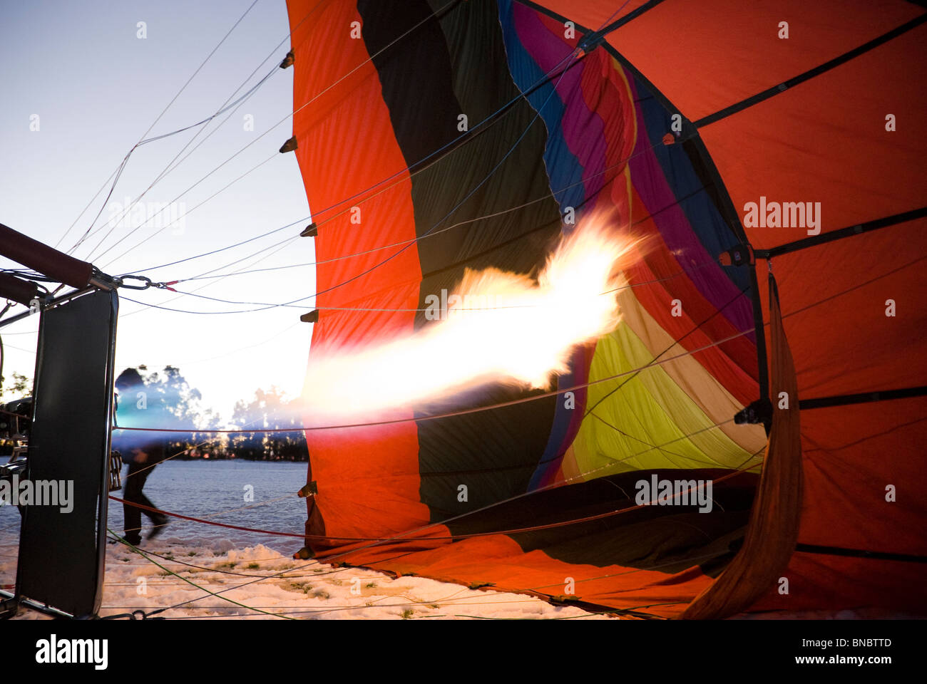 Hot air balloon being inflated on a snowy morning. Christchurch, New Zealand Stock Photo