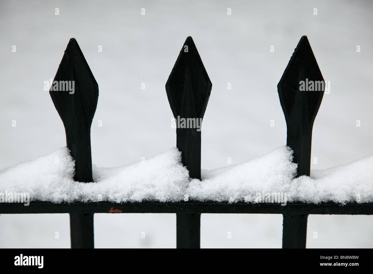 Wrought iron fence spikes in the snow in Kensington Palace garden, Hyde