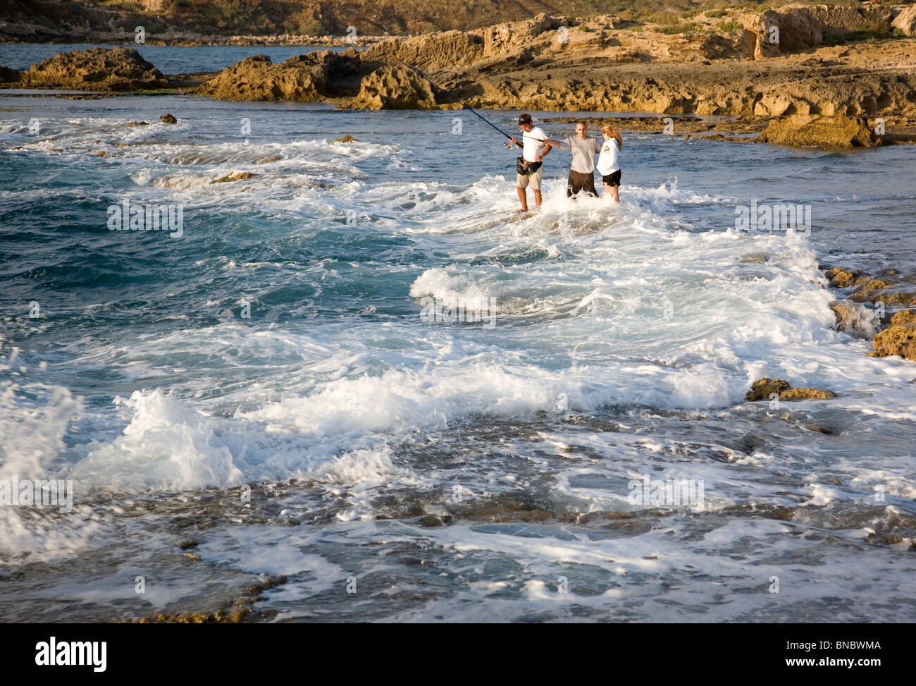 Line fishing from rocks hi-res stock photography and images - Alamy