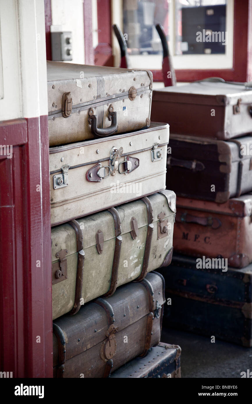 Old suitcases at railway station steam era Stock Photo