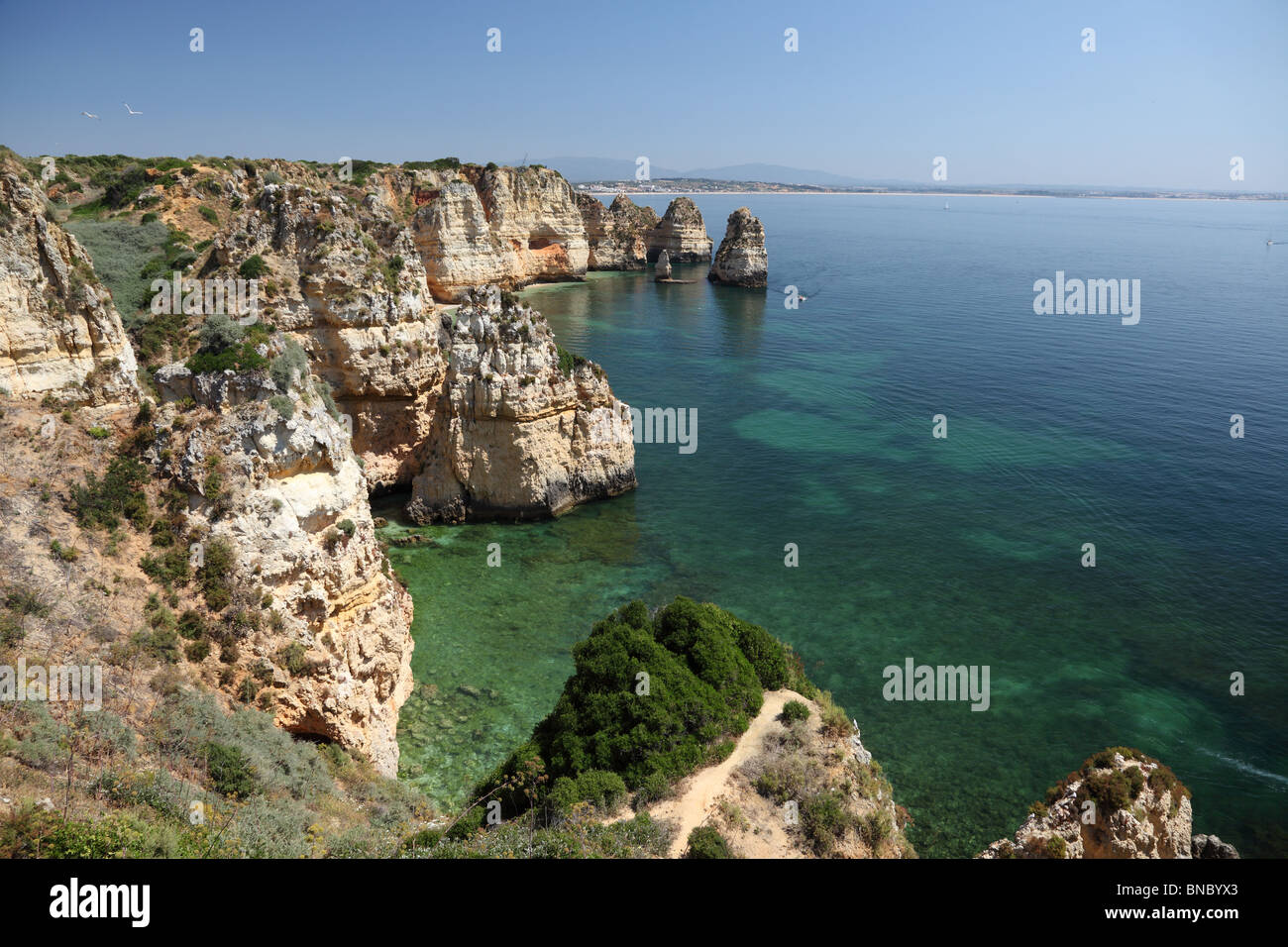Cliffs at Atlantic Ocean coast in Algarve, Portugal Stock Photo