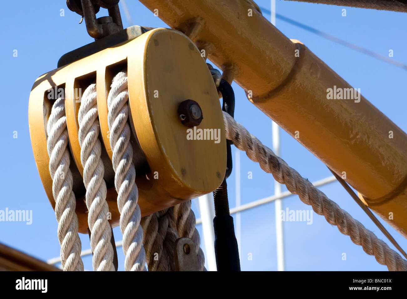 Wooden Pulleys and ropes in the rigging of a 1880´s ship Stock Photo