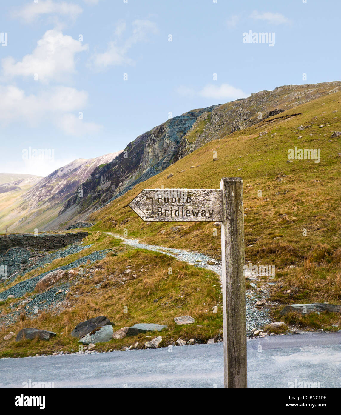 Wooden bridleway footpath signpost sign at Honister Pass The Lake District Cumbria England UK Stock Photo