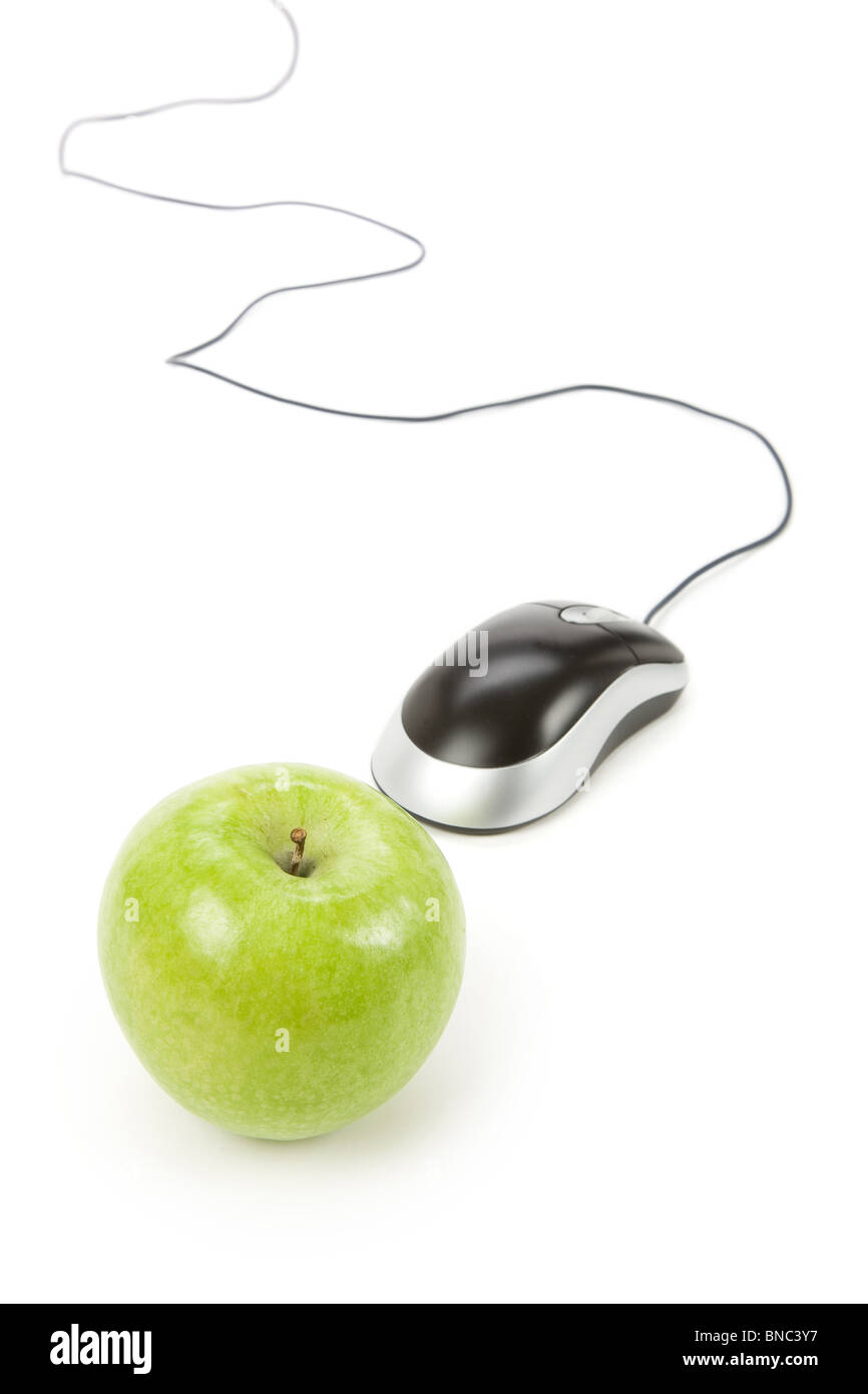 green apple and computer mouse, concept of online learning Stock Photo