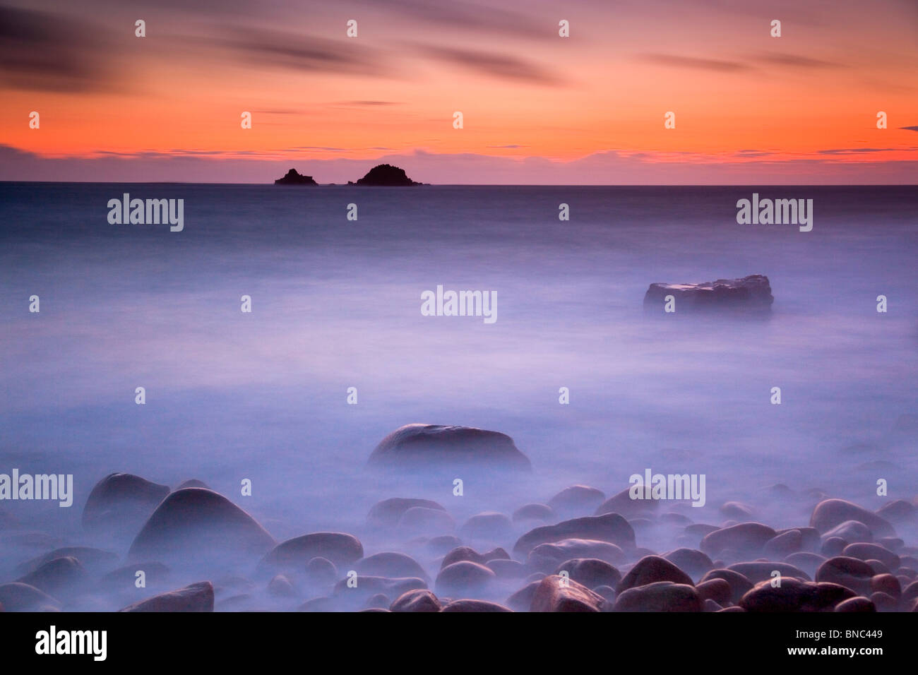 Porth Nanven; sunset looking towards The Brisons; Cornwall Stock Photo