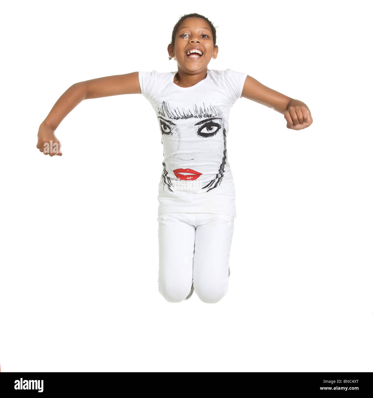 beautiful mixed race young girl leaping and jumping isolated against white background. Stock Photo