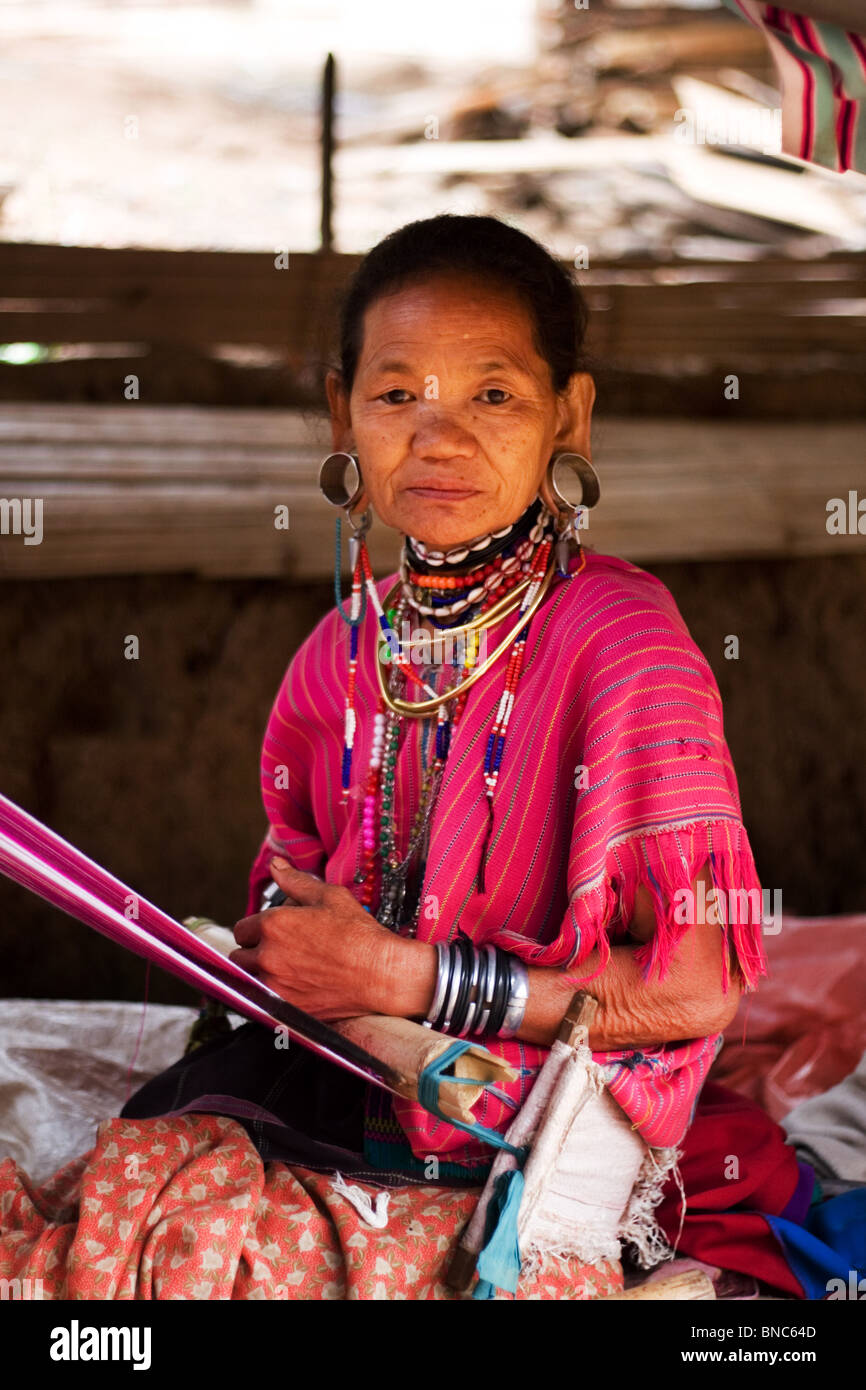 Old woman from Karen hill tribe with stretched ear lobes and wearing traditional dress, Tha Ton, Chiang Mai Province, Thailand Stock Photo