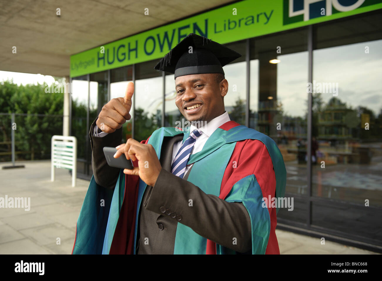 Student wearing Doctoral gown after receiving his degree  at Aberystwyth University Graduation day, Wales UK Stock Photo