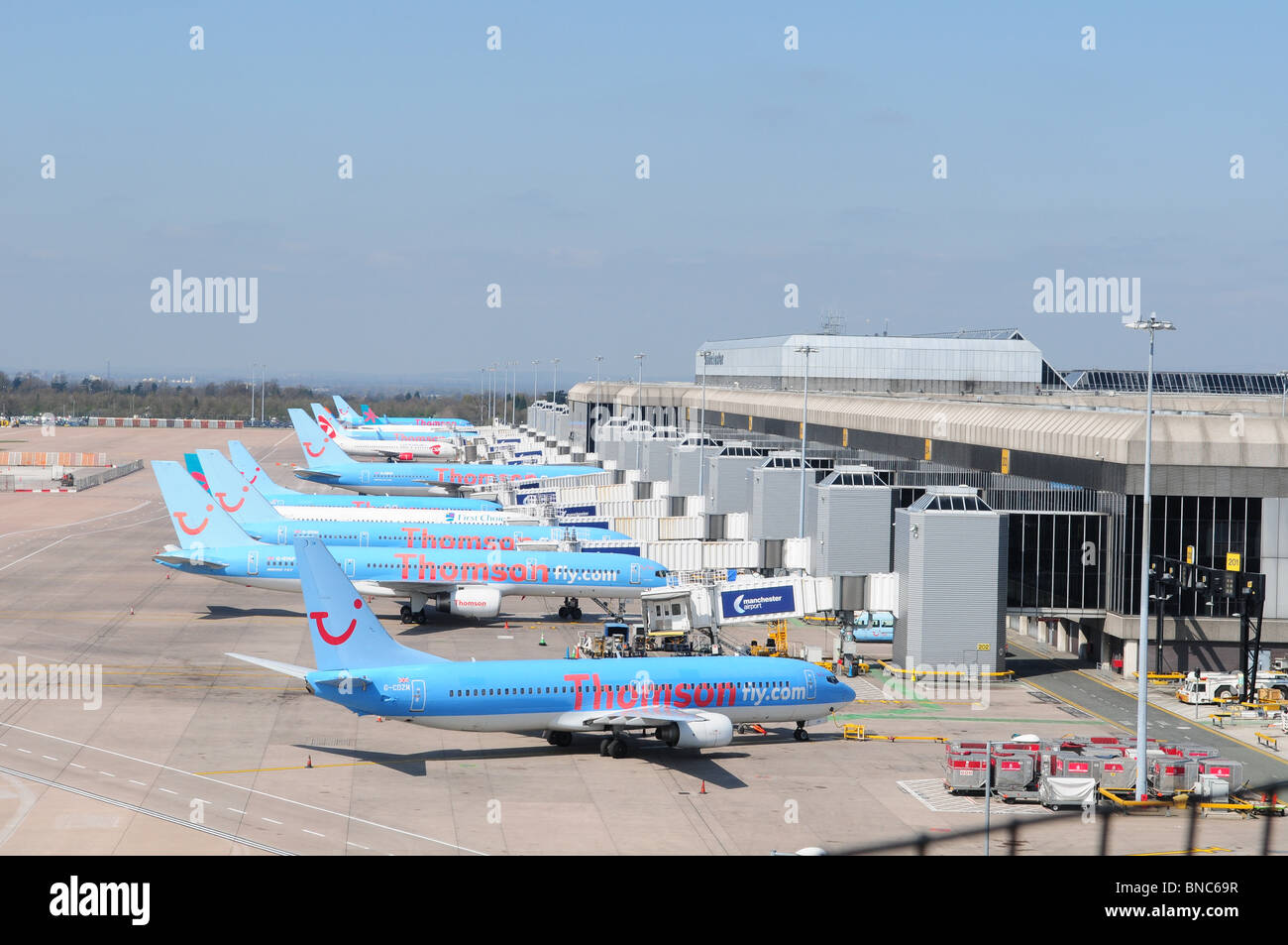 Planes parked at the gates at Manchester Airport. Stock Photo