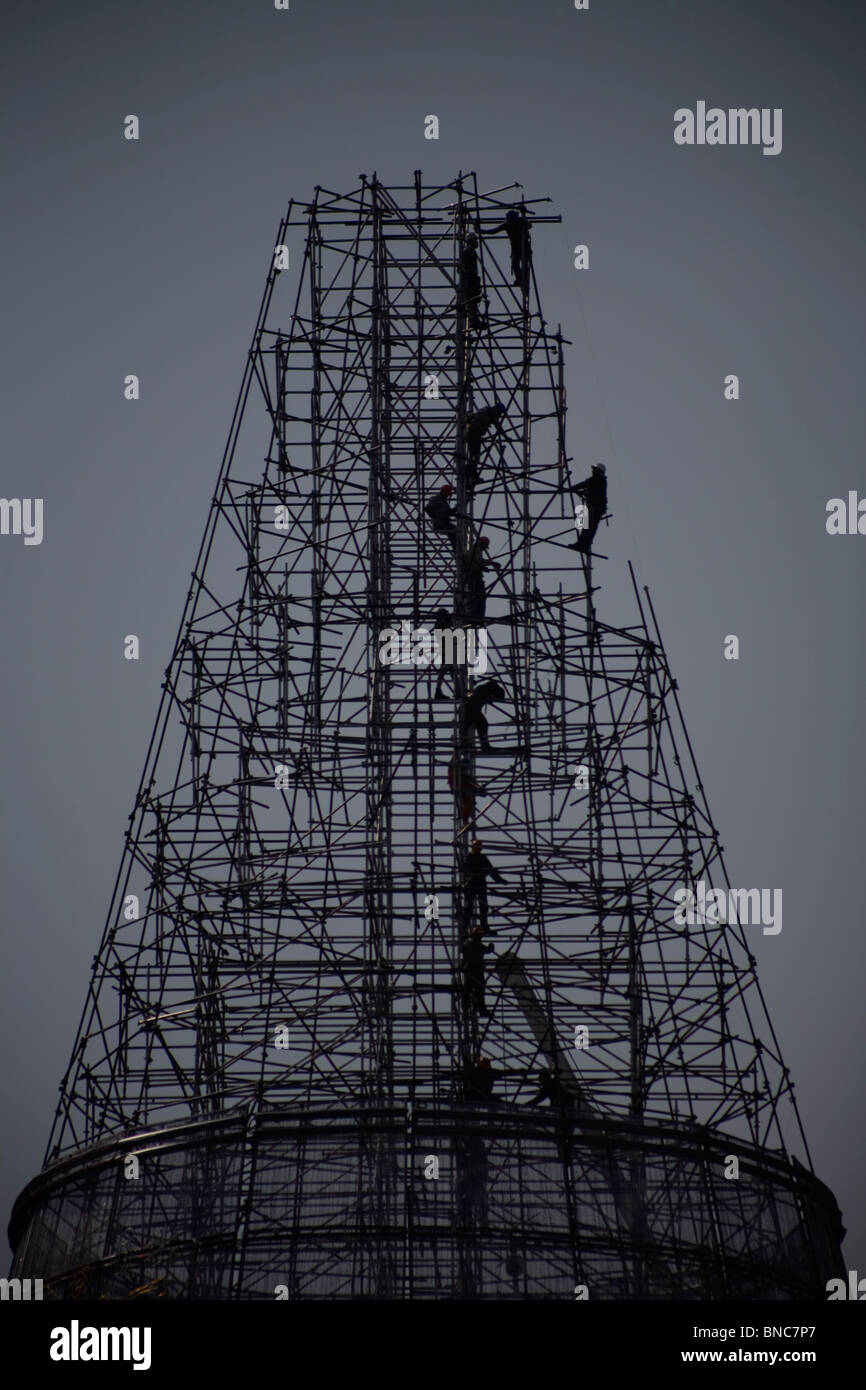 Workers make a giant Christmas tree in Mexico City, November 25, 2009. Stock Photo