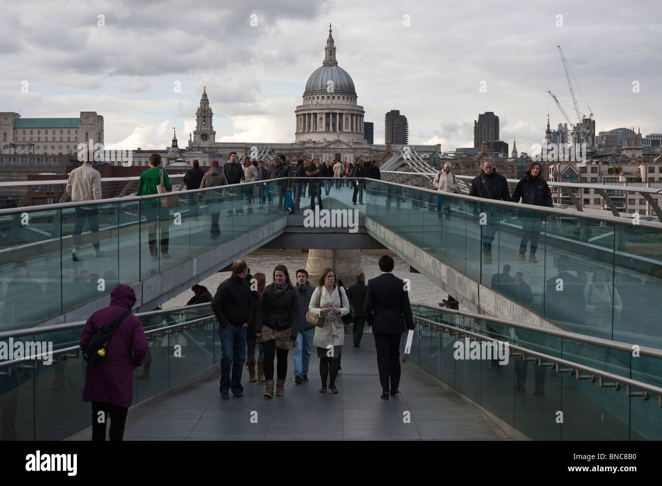 St Paul's Cathedral from the Millennium Bridge. View looking north from the  modern footbridge over the Thames. Stock Photo