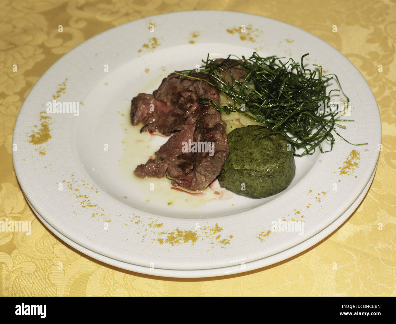 veal with spinach and rice sicily italy Stock Photo