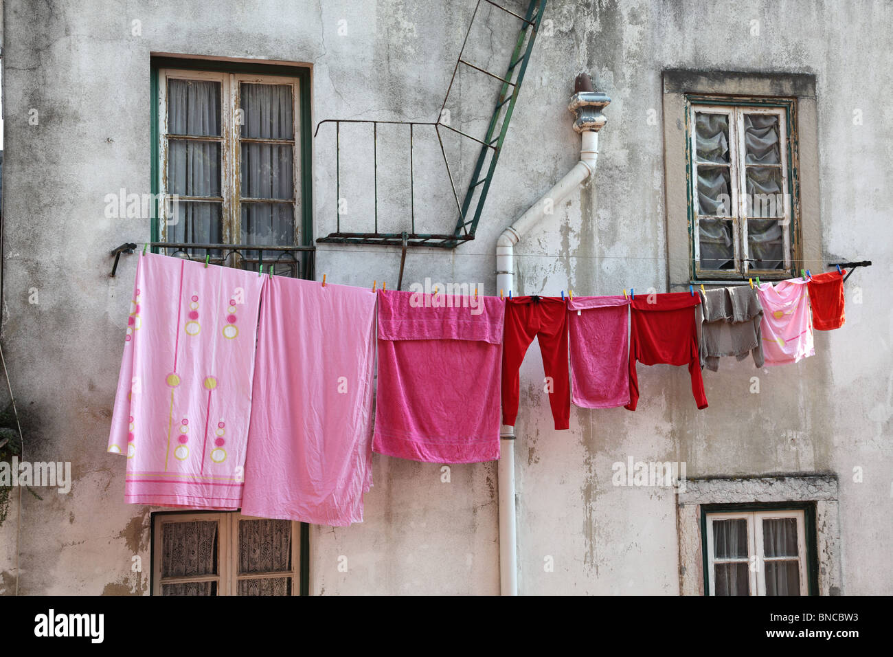 Washed clothes drying in the sun. Typical scene for Portugal and other