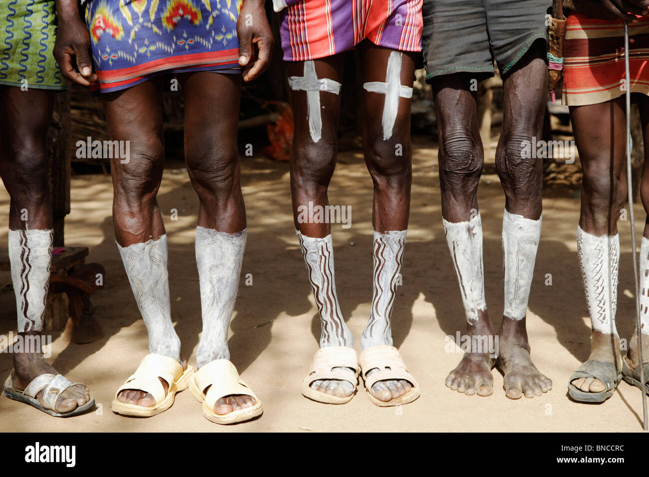 Tsemai men from Southern Ethiopia are showing off their leg body painting Stock Photo