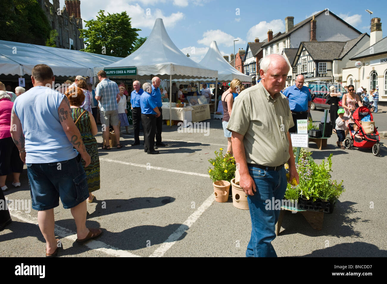 People enjoying the Hay Food Festival in the market square in Hay-on-Wye Powys Wales UK Stock Photo