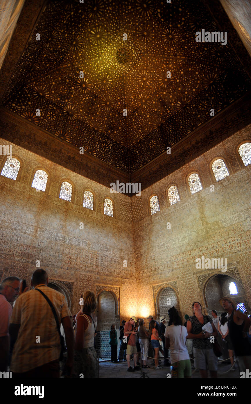 Alhambra Palace - Tourists admiring the ceiling of the Comares Hall one of the most important state rooms Stock Photo