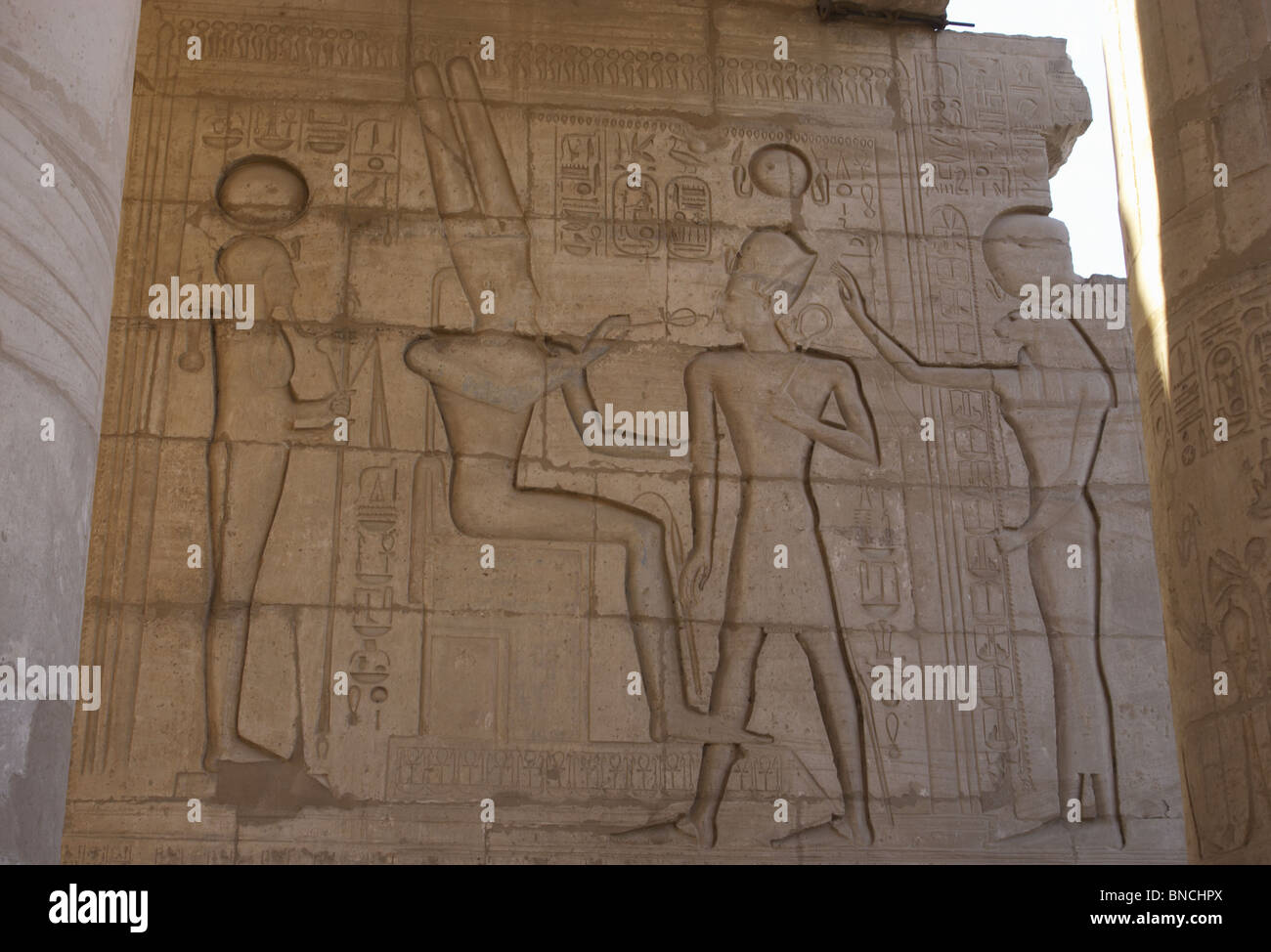 Relief depicting a Pharaoh Ramses II before gods Amun, Ptah and Tefnut. Ramesseum. Egypt. Stock Photo