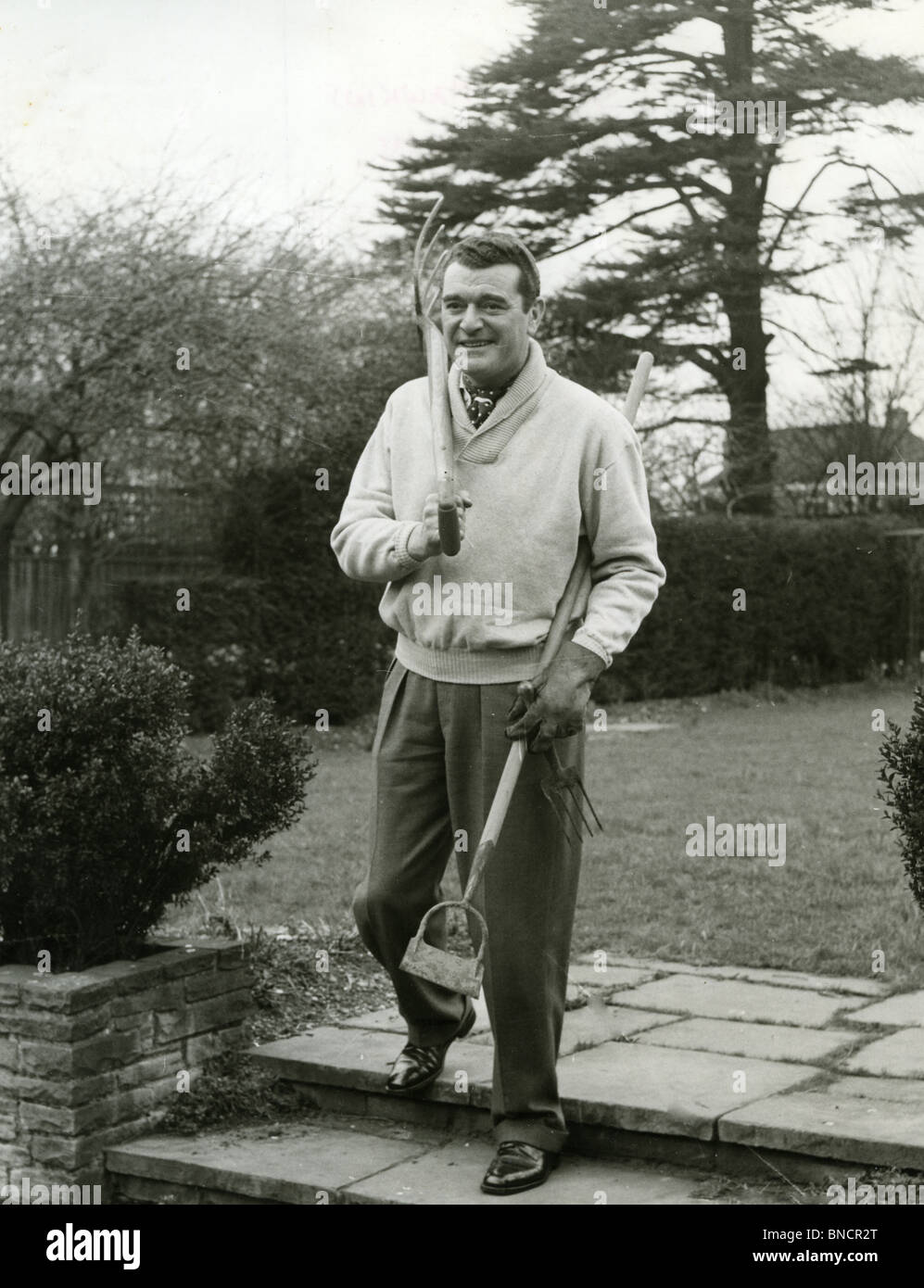JACK HAWKINS (1910-73) English film actor at his London home in ...