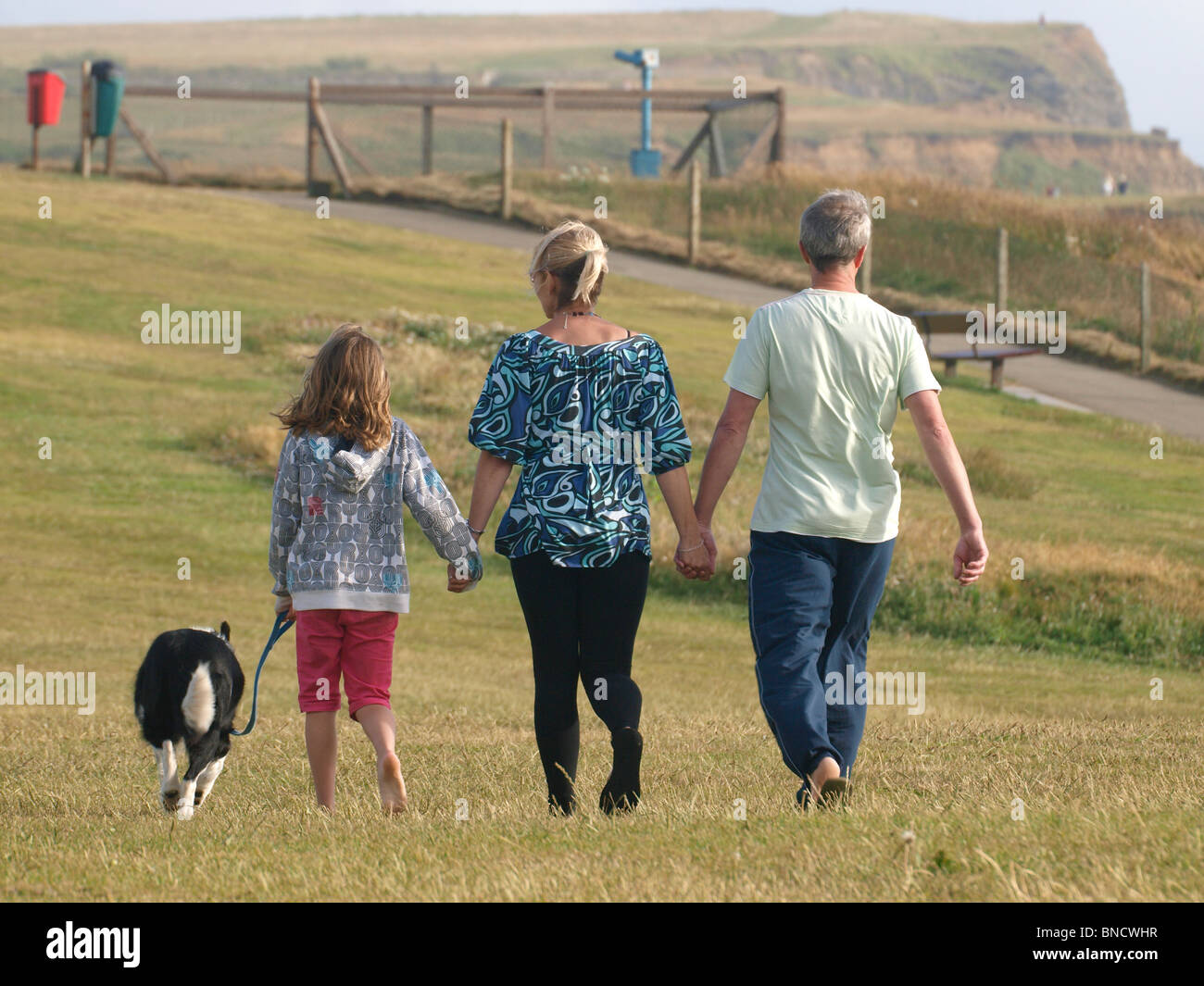 Girl walking a dog hi-res stock photography and images - Alamy