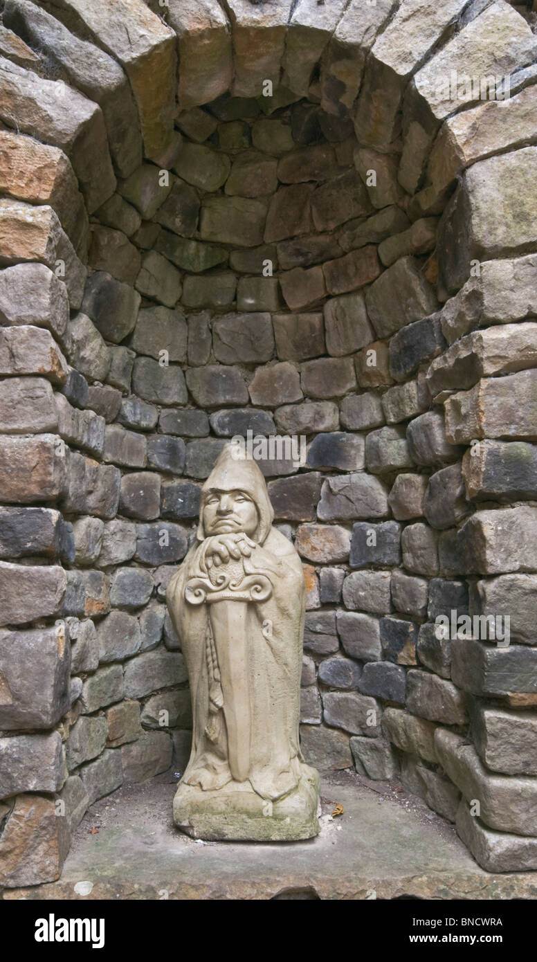 A stone figure in a wall niche at The Forbidden Corner near Middleham, North Yorkshire. Stock Photo