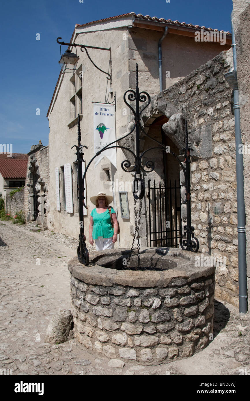 A well in the middle of a medieval village in the Auvergne, France. Stock Photo