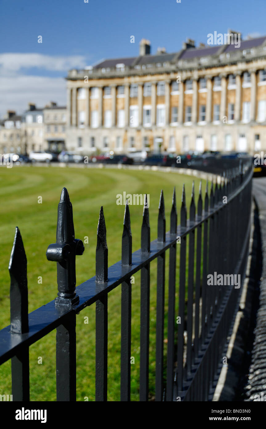 Railings skirting 'Royal Crescent' in the historic, planned Georgian city of Bath in the UK on a sunny day. Stock Photo