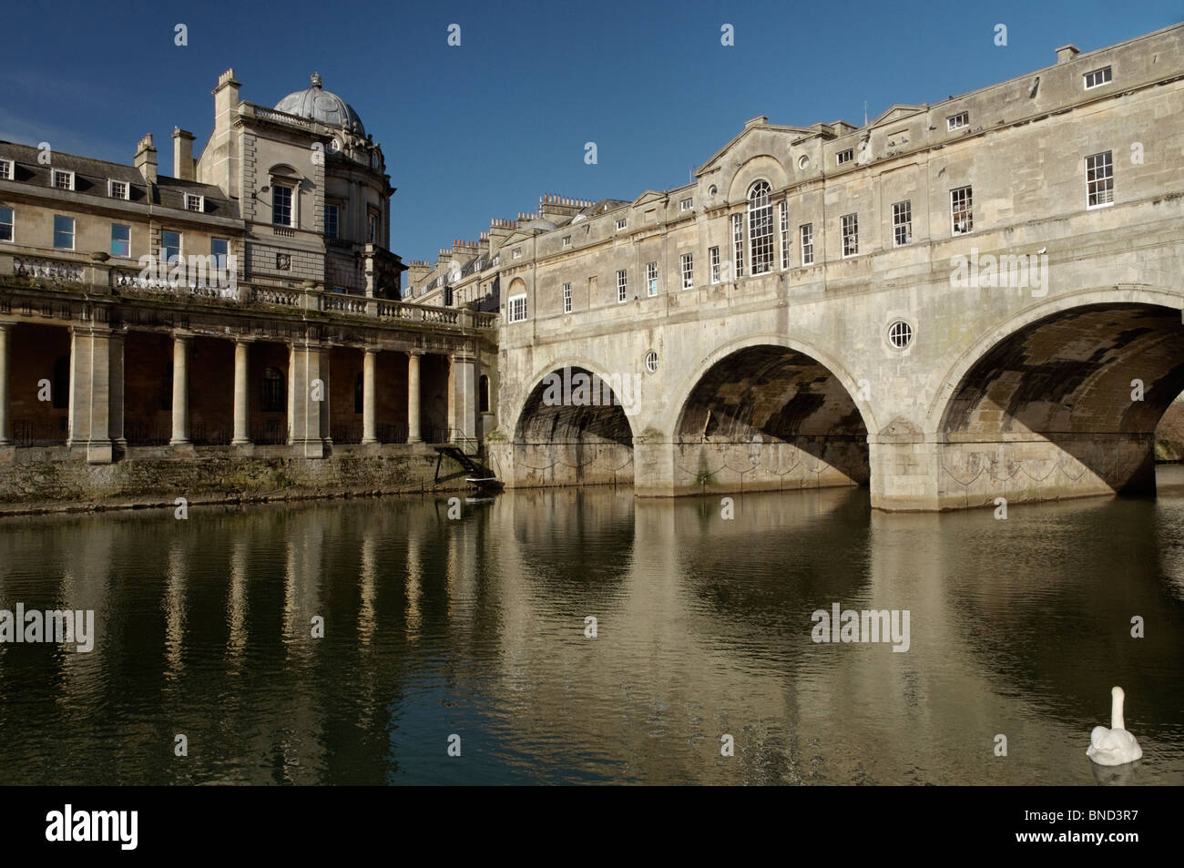 Morning sunlight shining on Pulteney Bridge over the river Avon In the Famous Georgian city of Bath in north east Somerset Stock Photo