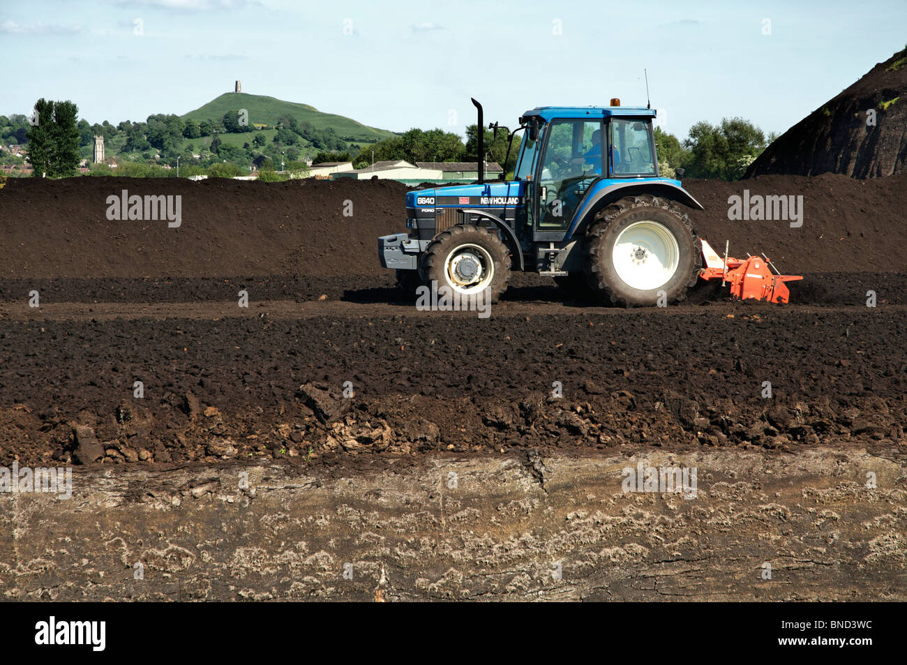 Peat cutting operation taking place on the Somerset levels near