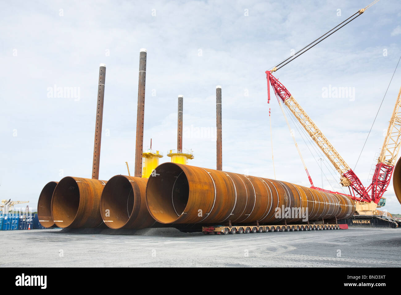 Monopiles waiting to be sunk into the seabed to support offshore wind turbines at Dong Energy's Walney Offshore wind farm. Stock Photo