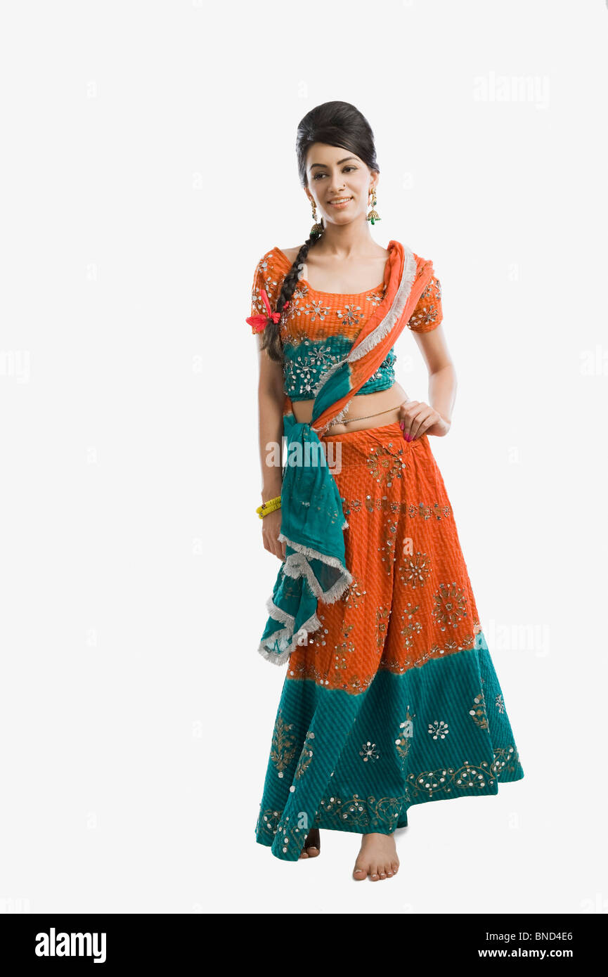 Woman standing with hand on hip Stock Photo - Alamy
